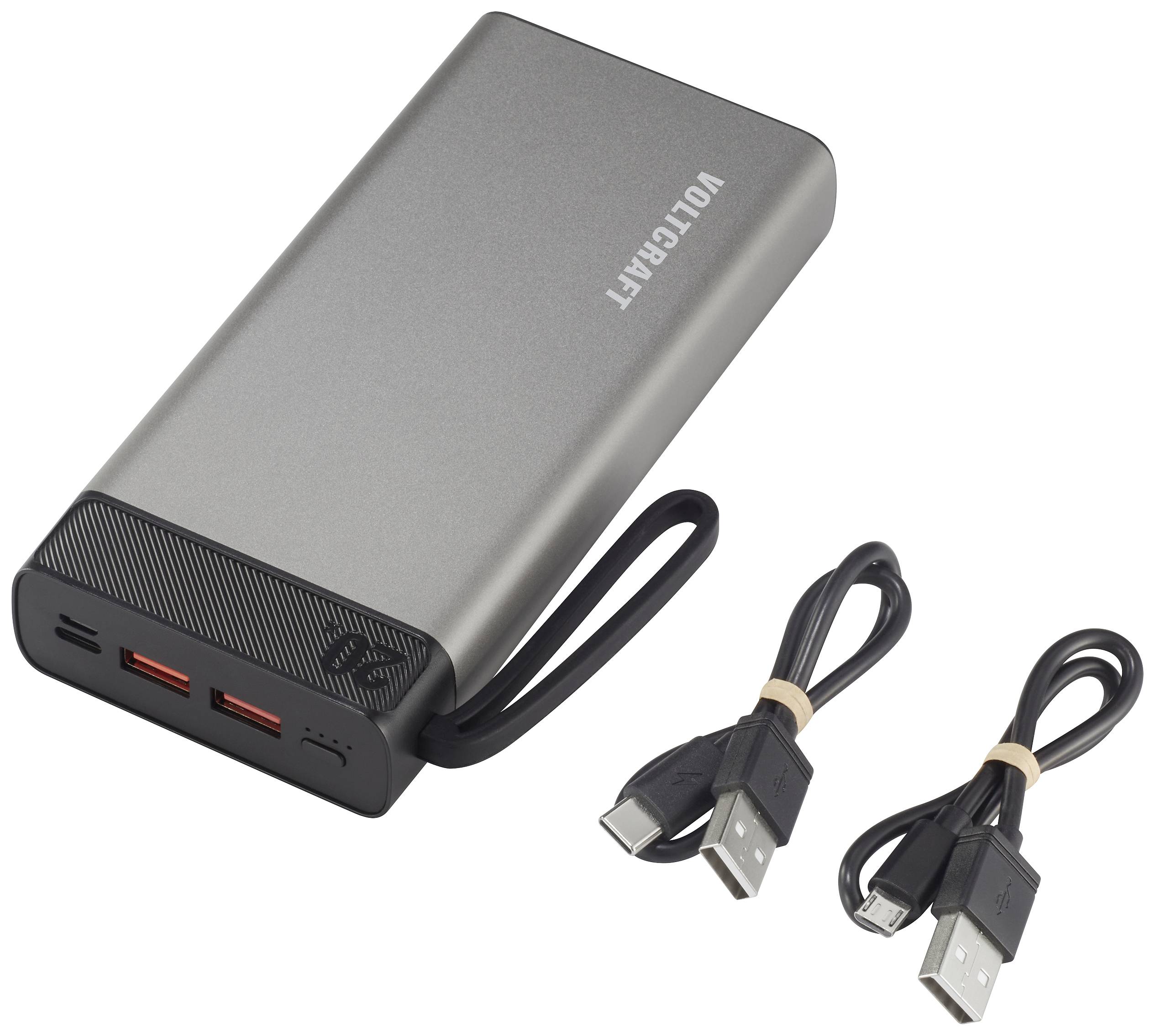 Siva powerbank s črnim kablom, dvema USB priključkoma in dvema priloženima USB kabloma. Blagovna znamka 'VOLTCRAFT' je vidna.