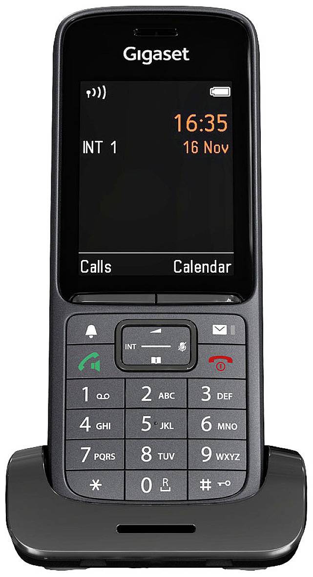 Brezžični telefon na polnilni postaji, zaslon prikazuje čas '16:35', datum '16. nov.', tipkovnica s številčnimi in funkcijskimi tipkami.
