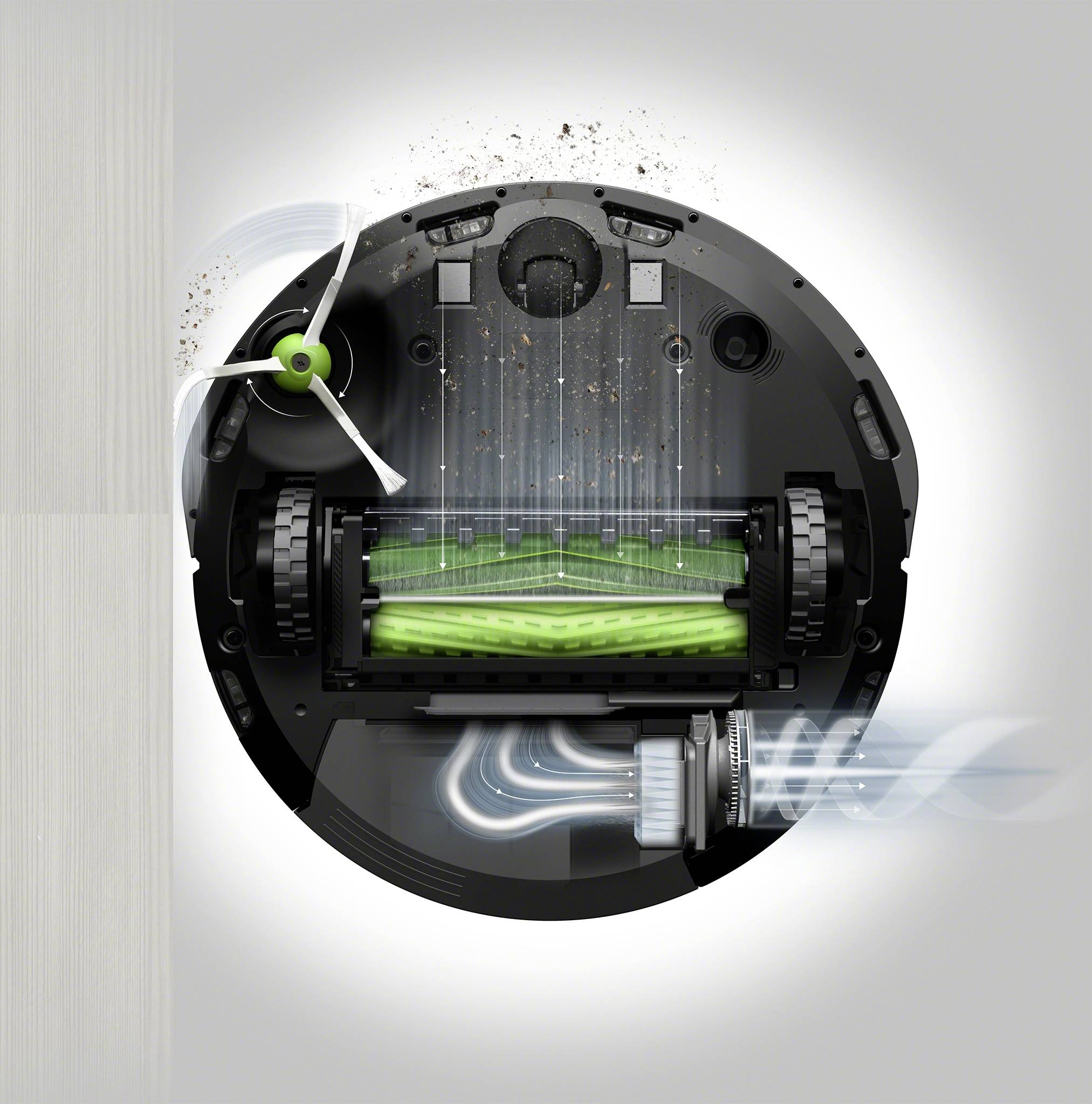 Okrogel sesalni robot, ki od spodaj pobira umazanijo in jo s krtačkami in filtirskim sistemom prenaša v zbirnik.