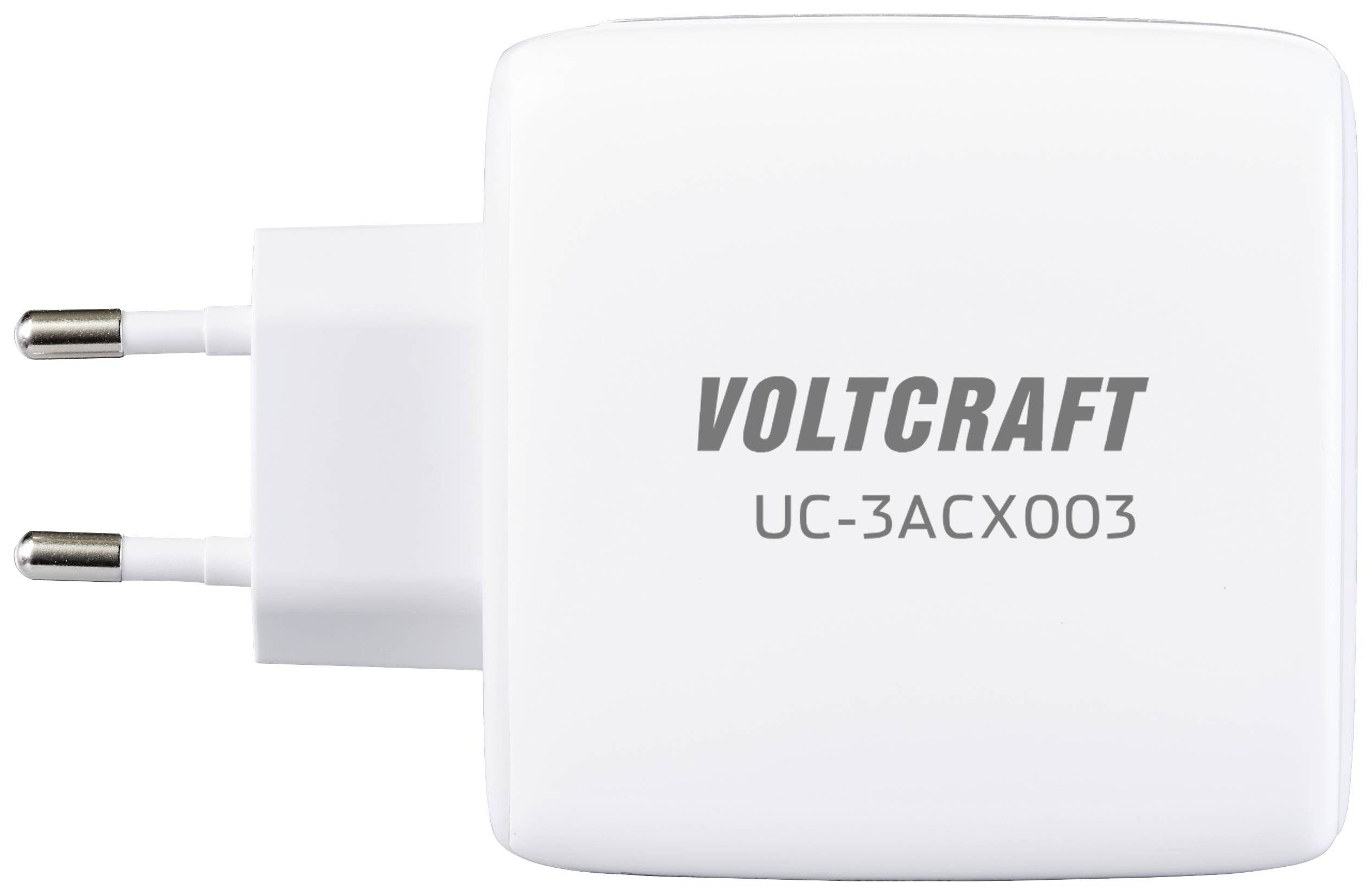 Belo napajanje z napisom 'VOLTCRAFT UC-3ACX003' in dvema okroglima vtičnima kontaktoma.