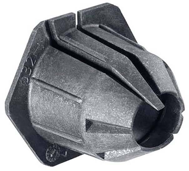 Cilindru podoben, siv plastičen del z več utori in ostrim robom, verjetno tehnični komponenta ali adapter.