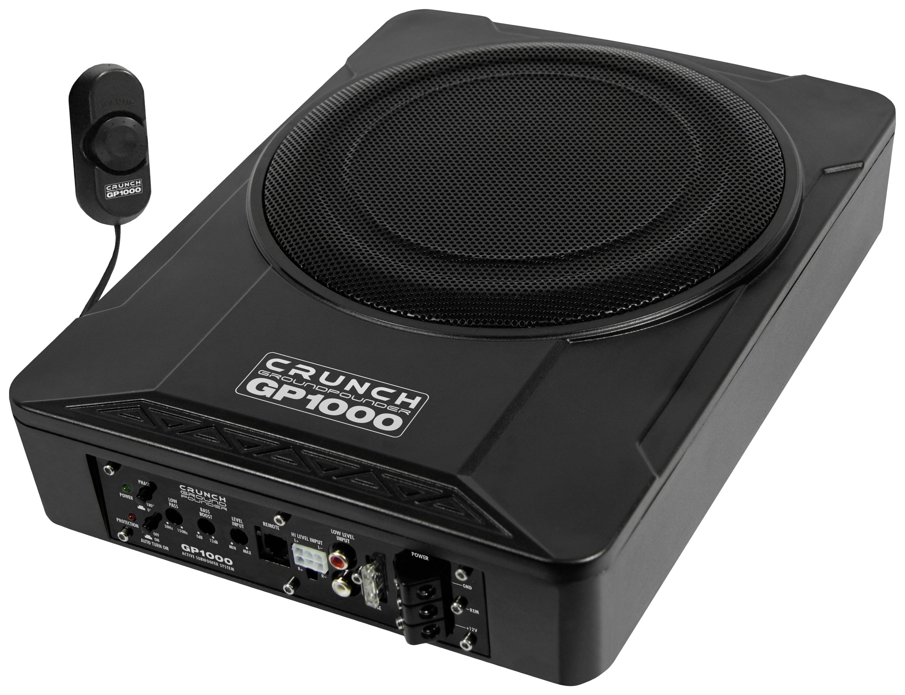 Črn Crunch GP1000 subwoofer z vgrajenim ojačevalcem. Priložena je daljinski upravljalnik, funkcije so razvidne.