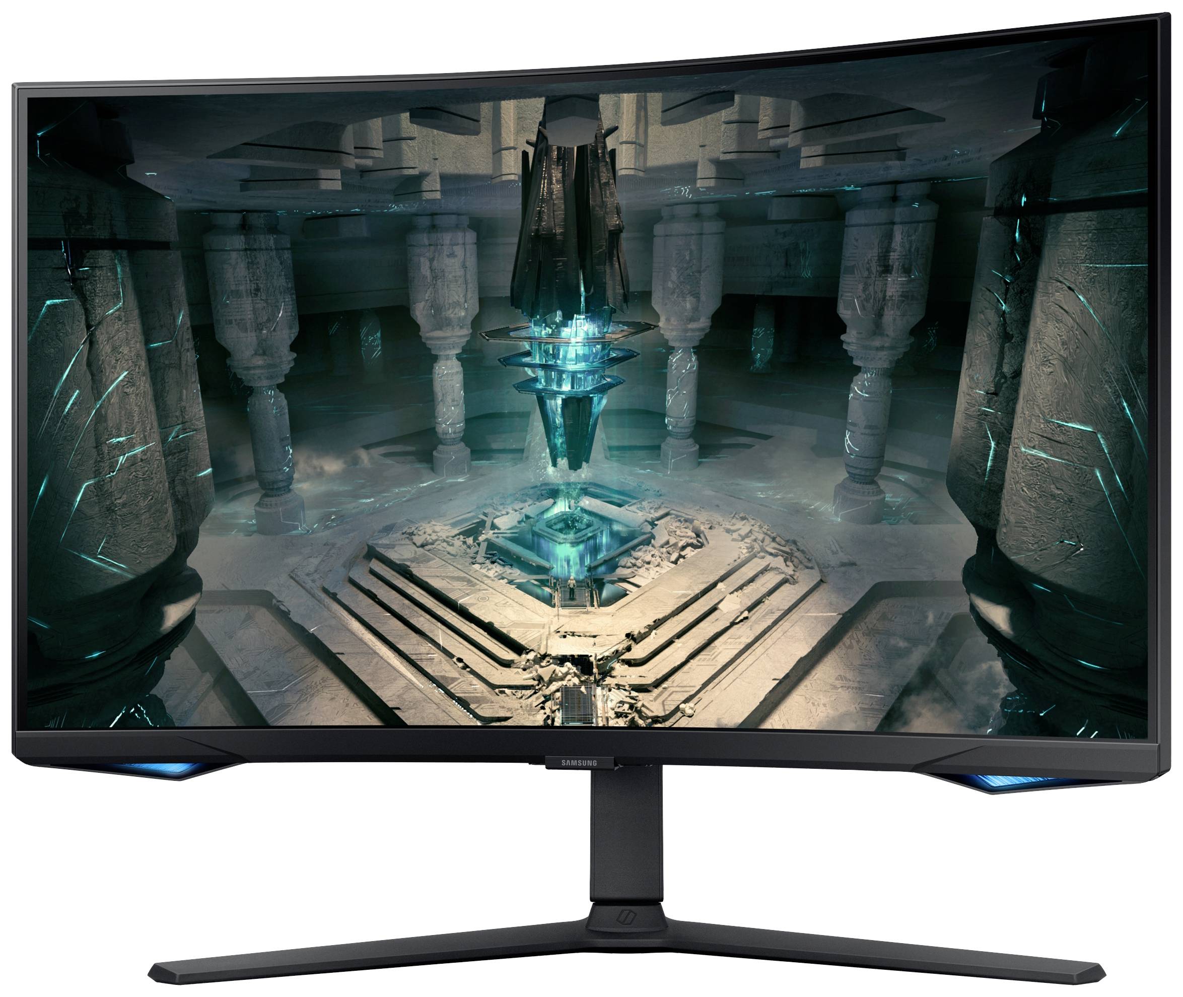 Ukrivljen gaming monitor z futurističnim, svetlečim modrim kristalnim dizajnom na zaslonu v stolpničnem prostoru.