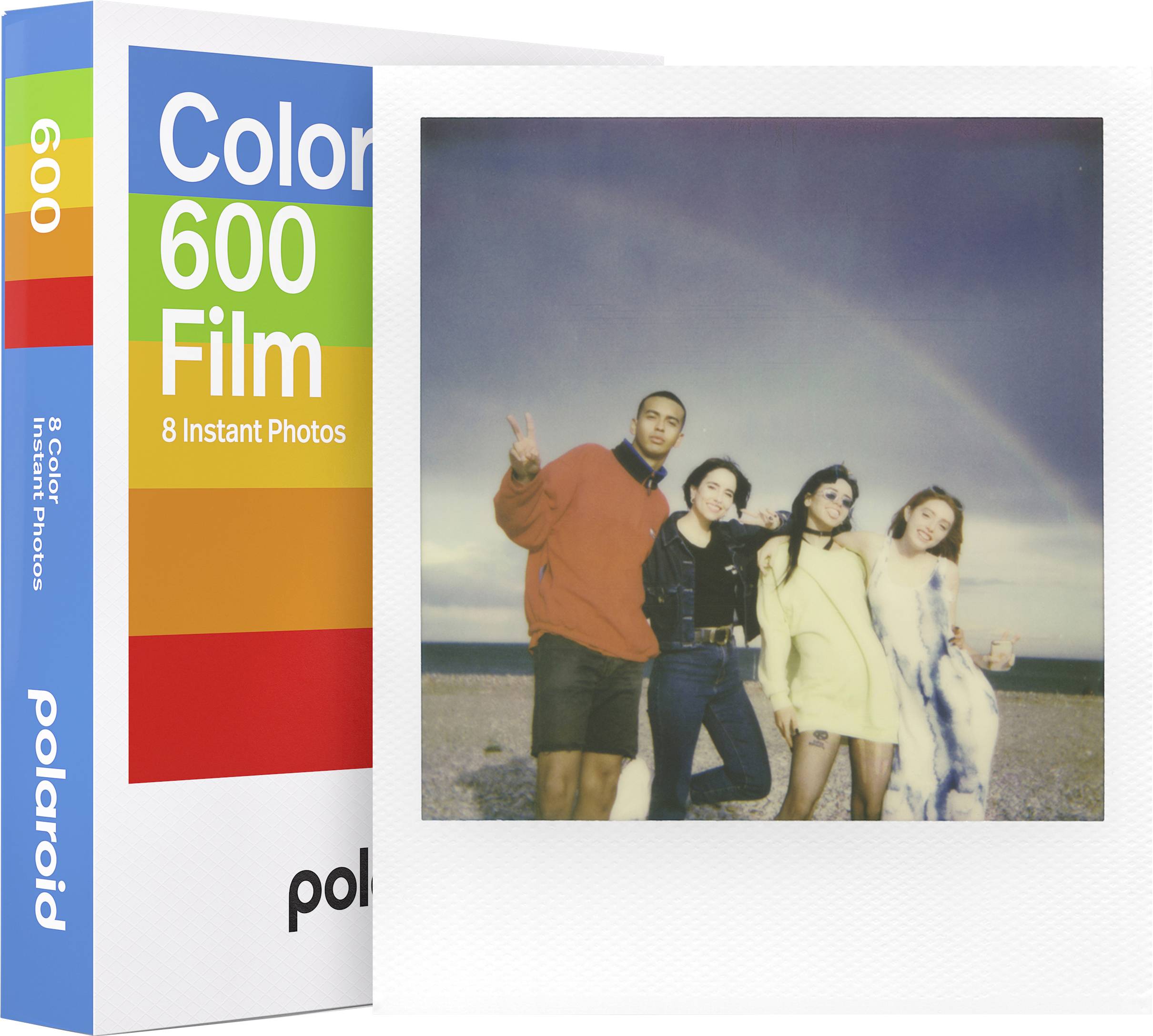 Štiri osebe veselo pozirajo pred ozadjem obale pod mavrico. Desno poleg tega je škatla filma 'Color 600'.