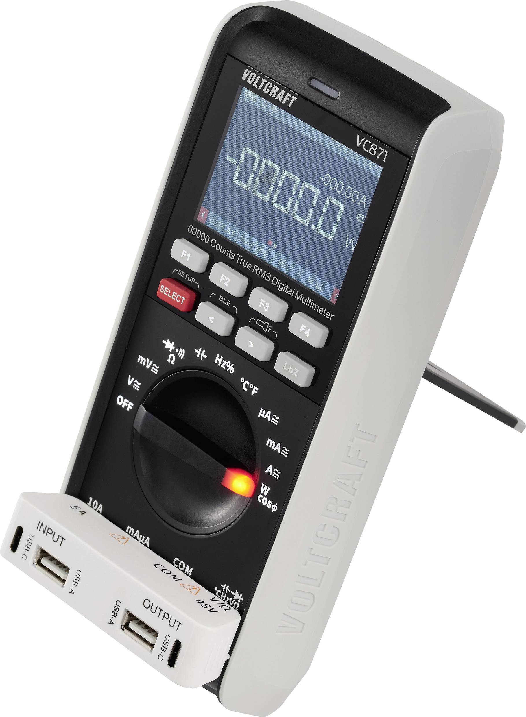 Digitalni multimeter z zaslonom, ki prikazuje izmerjeno vrednost. Črne tipke za različne funkcije, stranski USB priključki so vidni.