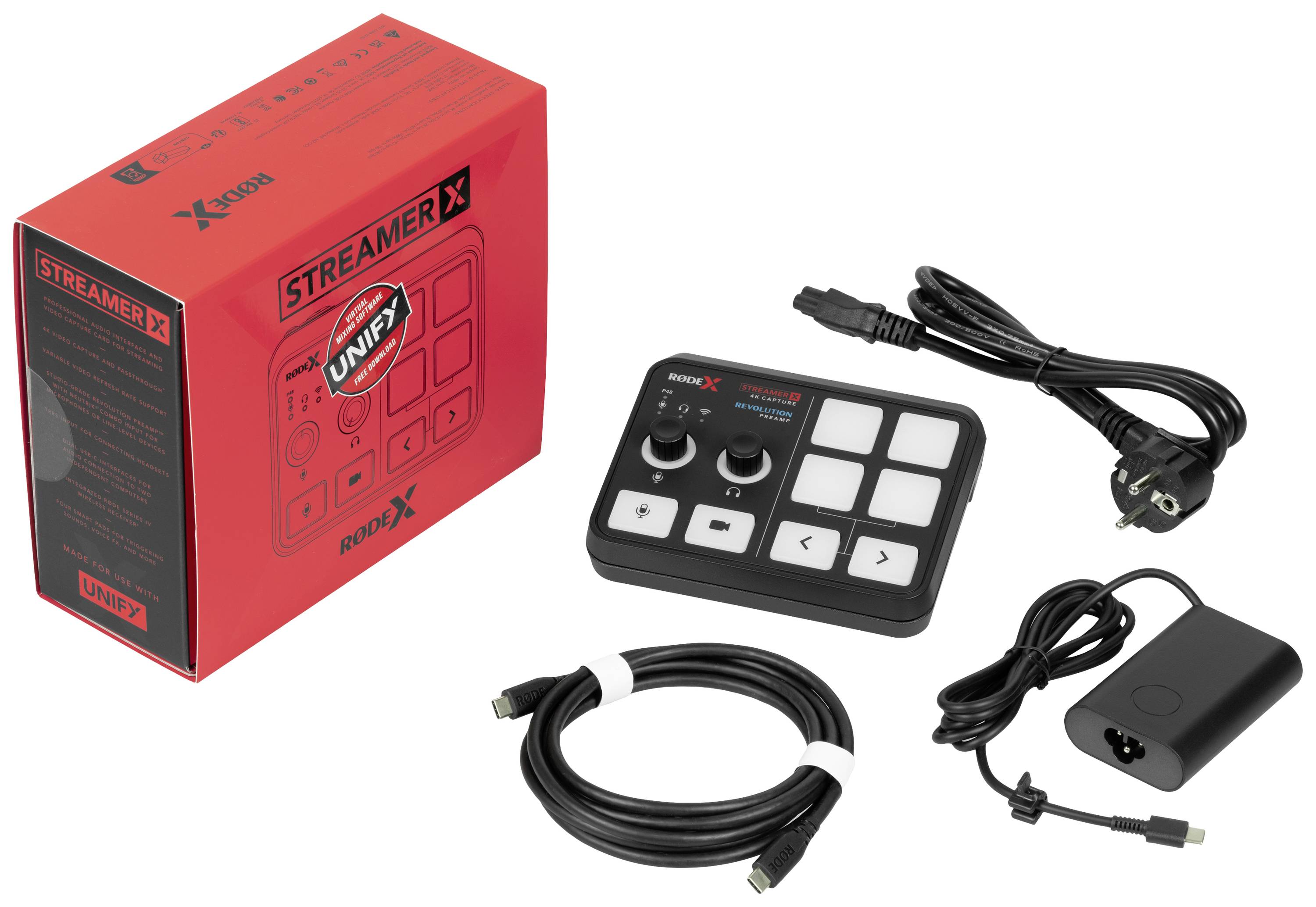 Komplet vmesnika 'STREAMER X' sestavljen iz rdečega kartona, krmilnika z več tipkami in kablovja.