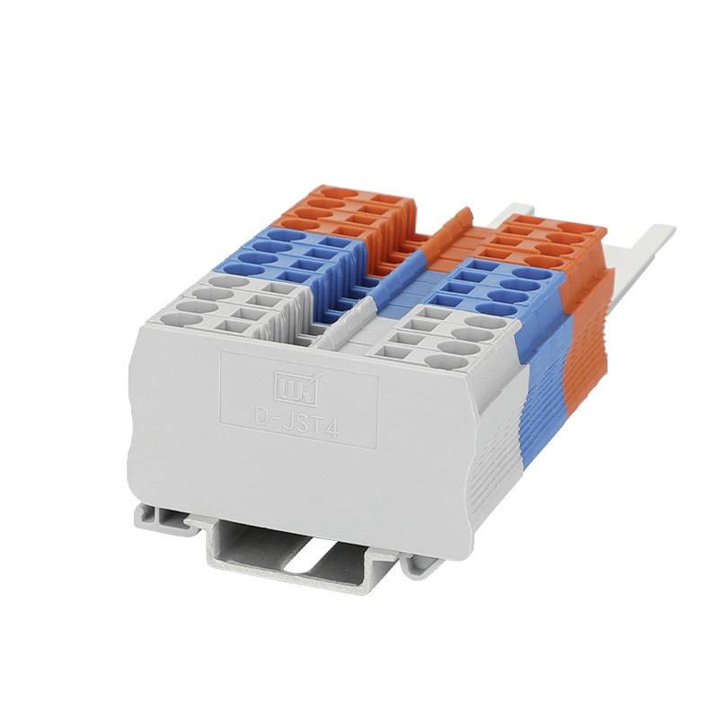 Električni vtični priključek z modrimi, rdečimi in sivimi kontaktnimi ploščami ter priključkom za ozemljitev za povezavo vodnikov v razdelilnih omaricah.