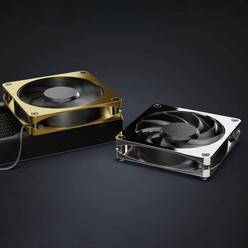 Dva računalniška ventilatorja v zlati in srebrni obrobi; ležita na temni površini, zlati model je rahlo dvignjen.