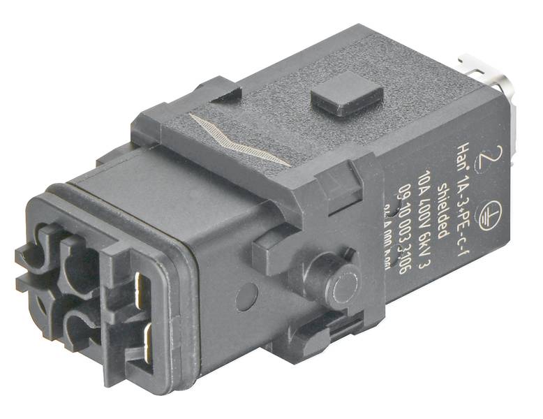 Črni elektronski priključek pravokotne oblike z več priključnimi točkami in napisom na strani.