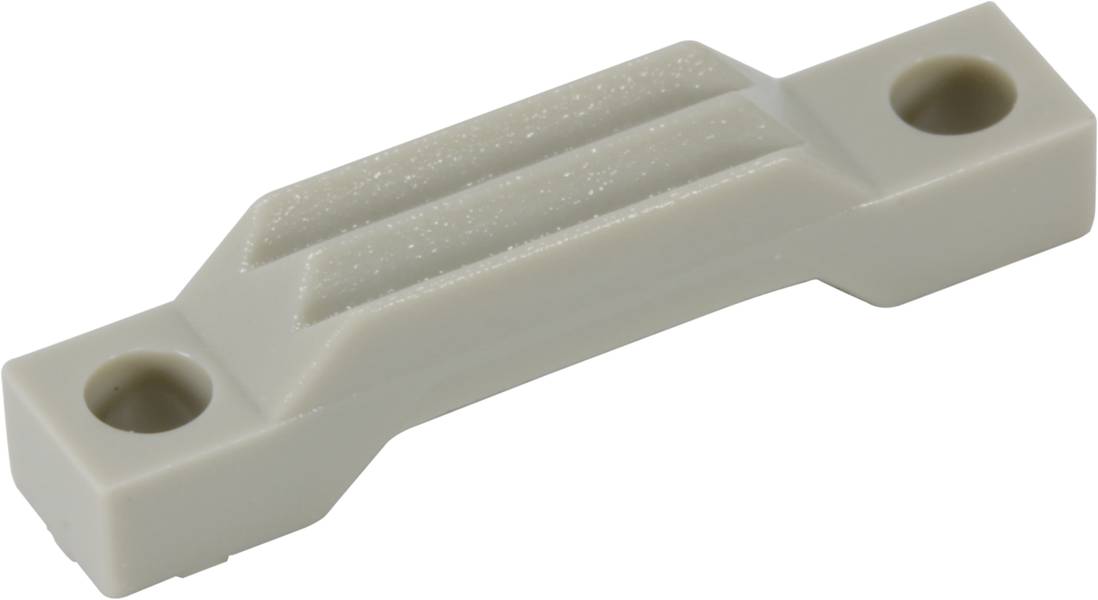 Bež plastični nosilec z dvema luknjama za vijake, pogled od zgoraj pod kotom.