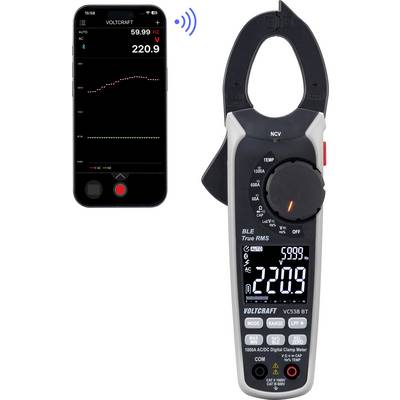 Slika prikazuje pametni telefon, ki ima odprto aplikacijo VoltageCraft merilnik, in stisko multimeter, ki kaže 220,9 V AC pri 59,99 Hz, z rdečim grafom trenda.
