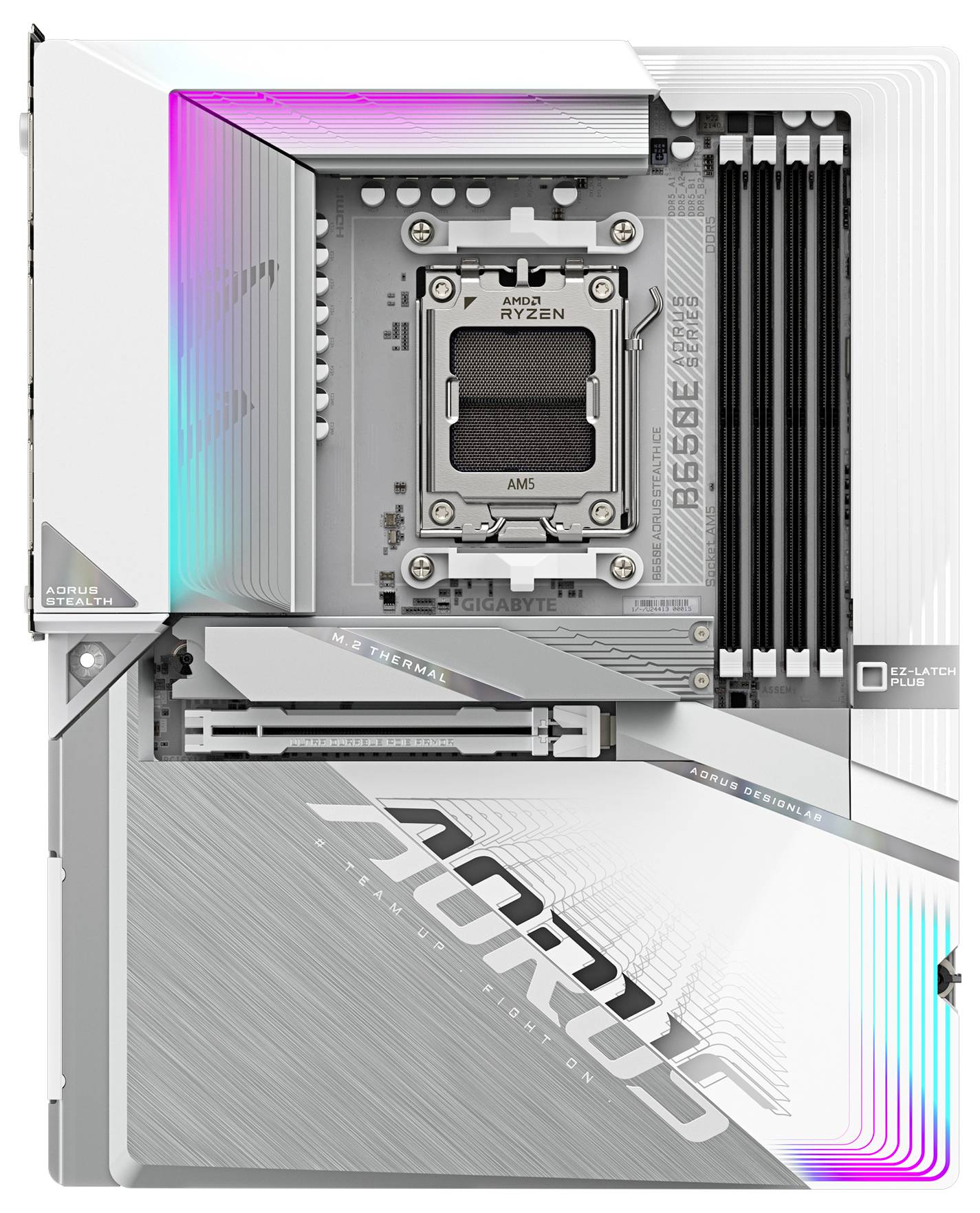 Srebrno računalniško matično ploščo z napisom 'AORUS' in prostorom za procesor AMD Ryzen. RGB svetlobni učinki na robovih.