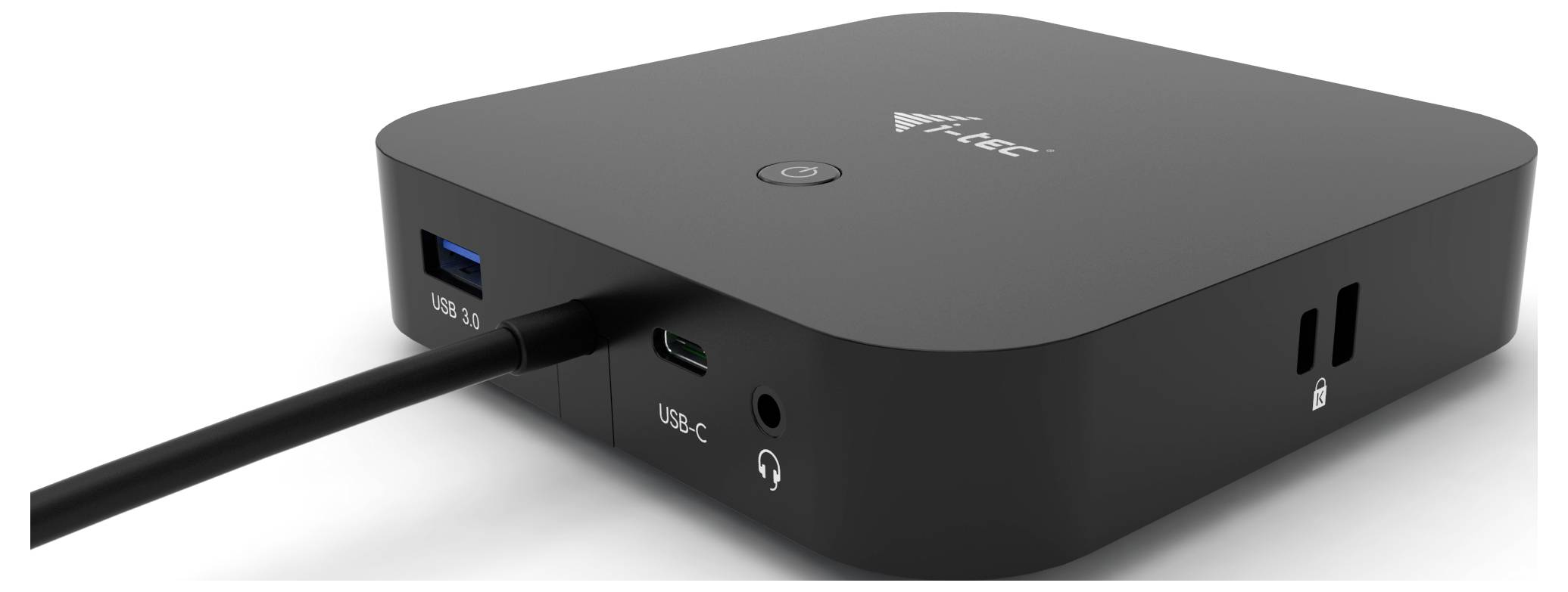 Črna elektronska škatla z USB priključki na strani in priključenim kablom.