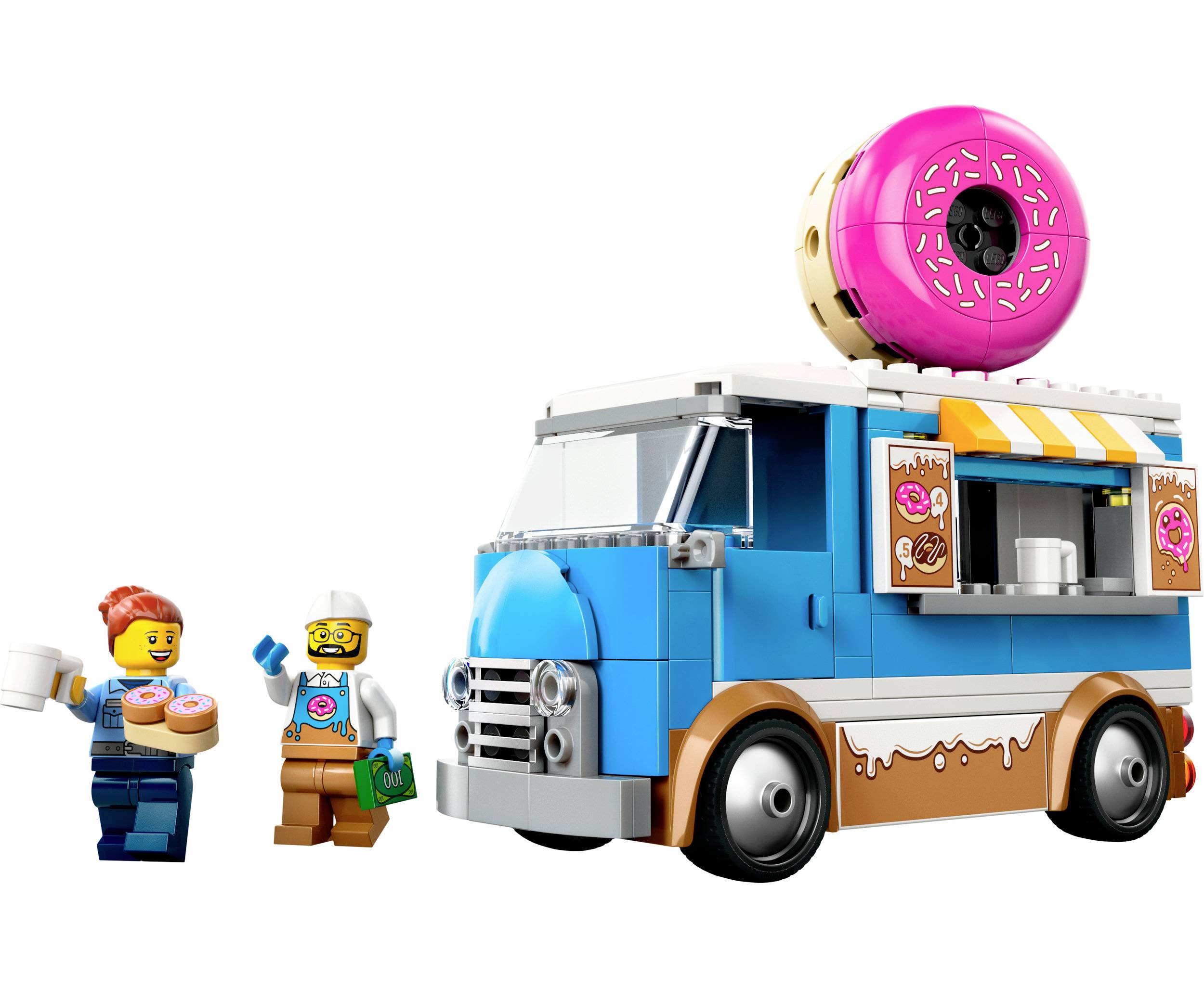 Moder prodajni voziček iz Lego kock z veliko okrasno donutko. Dve Lego figurici držita donute. Prizor zabave in medsebojnega delovanja.