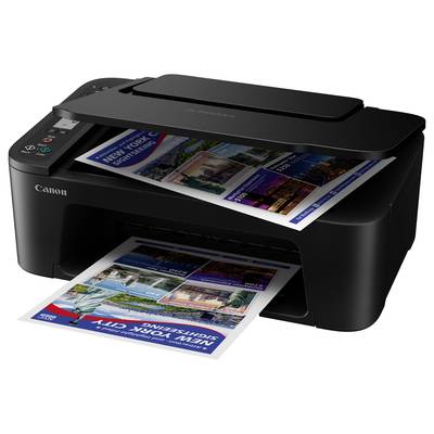 Črn Canon tiskalnik na mizi tiska barvni list s potovalnimi informacijami in fotografijami znamenitosti.