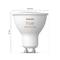 Philips Hue bela in barvna LED-žarnica z GU10 podnožjem, premera 50 mm, višine 57 mm. Nastavljiva v beli in barvni svetlobi.