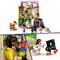 Pisana Lego scena z Lego hišo, figuricami, ki se igrajo in muzicirajo. Notranji pogled prikazuje figurico za računalnikom.