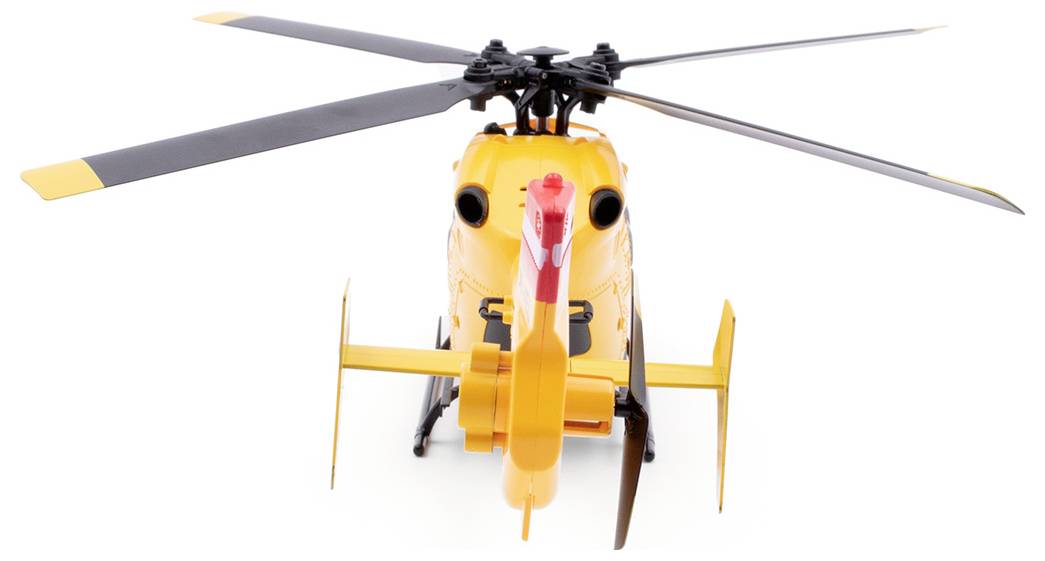 Rumeni igrački helikopter s črnimi in rdečimi detajli, fotografiran čelno od spredaj.