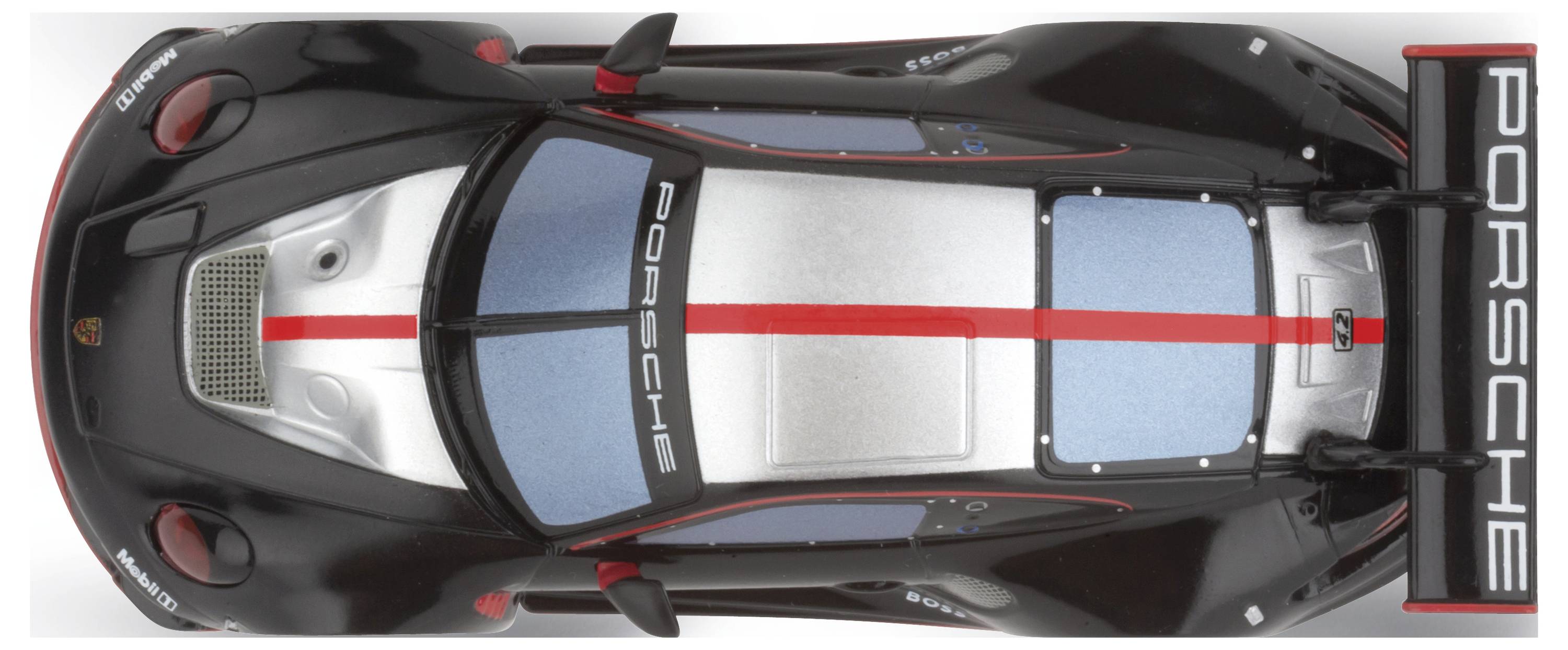 Igrača avtomobil, fotografirana od zgoraj, prikazuje športno oblikovan model v črni in srebrni barvi z rdečimi poudarki in napisom 'Porsche'.