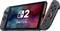 Konzola Nintendo Switch z ločenima krmilnikoma Joy-Con, ki prikazuje barvit zaslon z logotipom Nintendo in številko '2'.