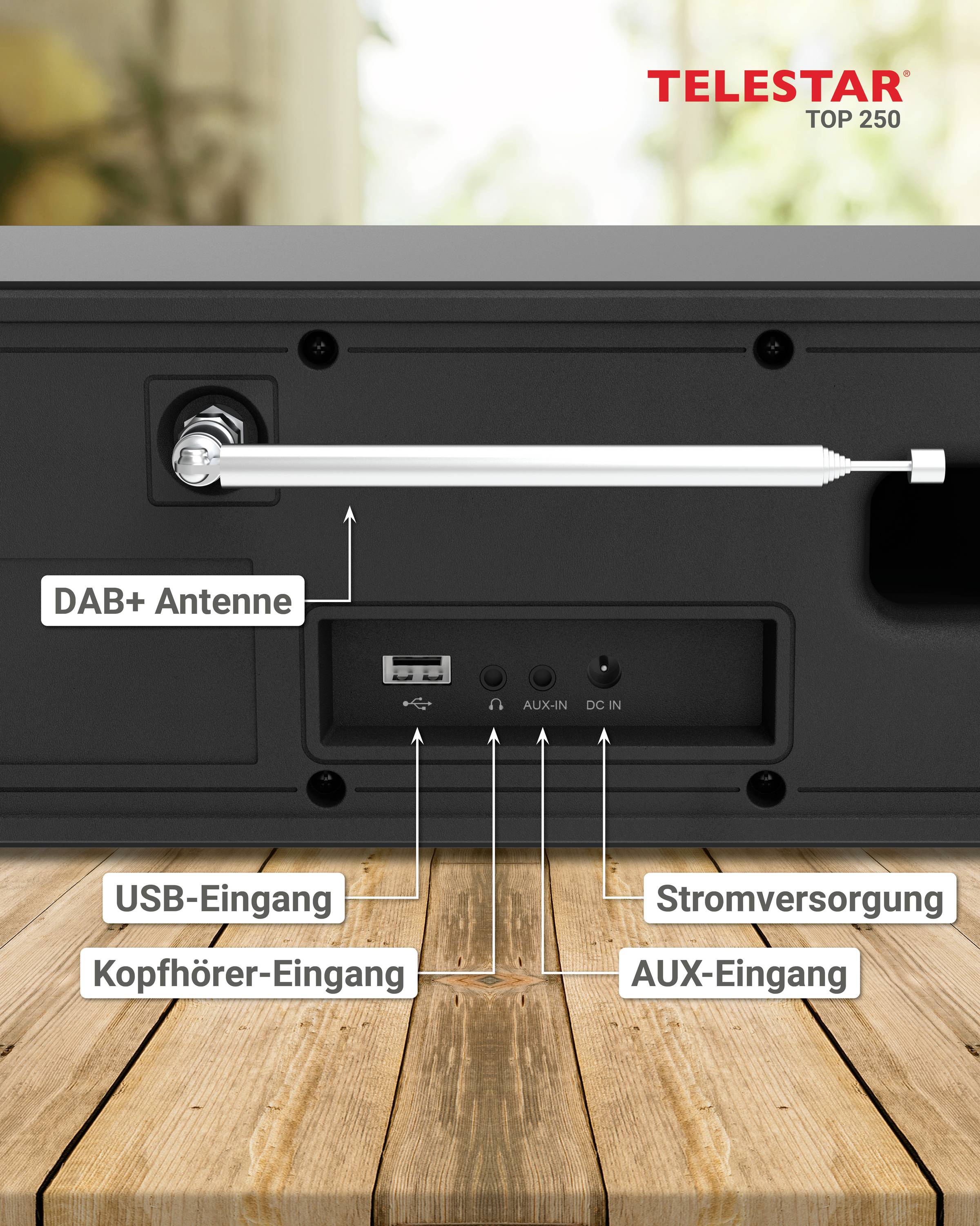 'TELESTAR TOP 250' Radio zadnja stran z DAB+ anteno. Prikazuje USB-, slušalke-, AUX-vhode in napajanje na leseni mizi.