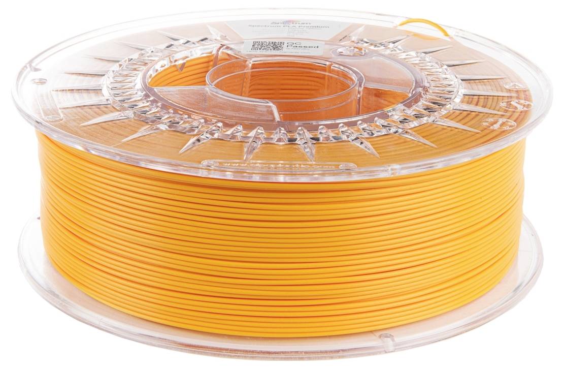 Kolut oranžnega 3D tiskalnega filamenta, enakomerno navit, v prozornem plastičnem držalu.