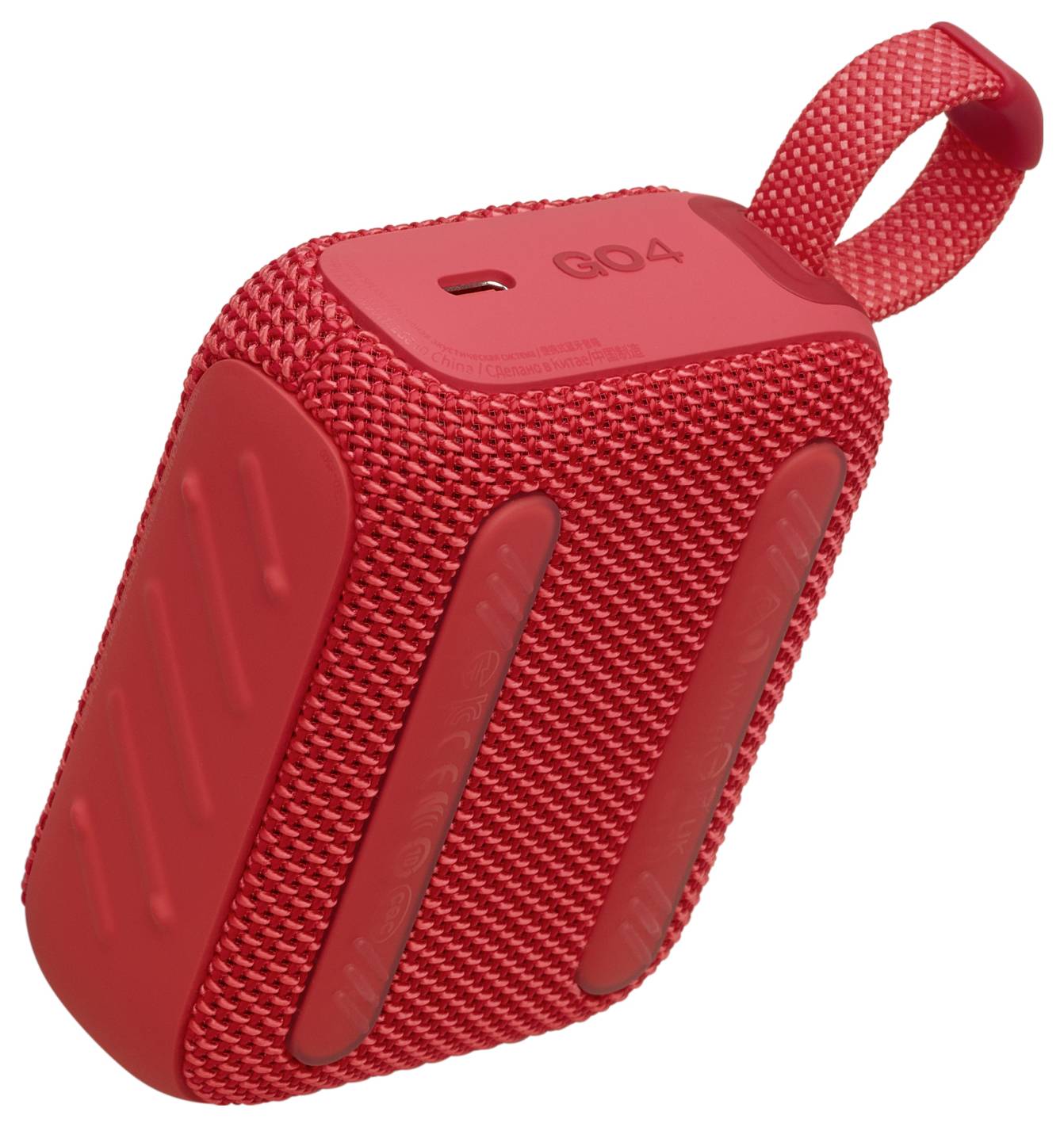 Rdeč prenosni bluetooth zvočnik s teksturirano površino in pritrjeno zanko za prenašanje.
