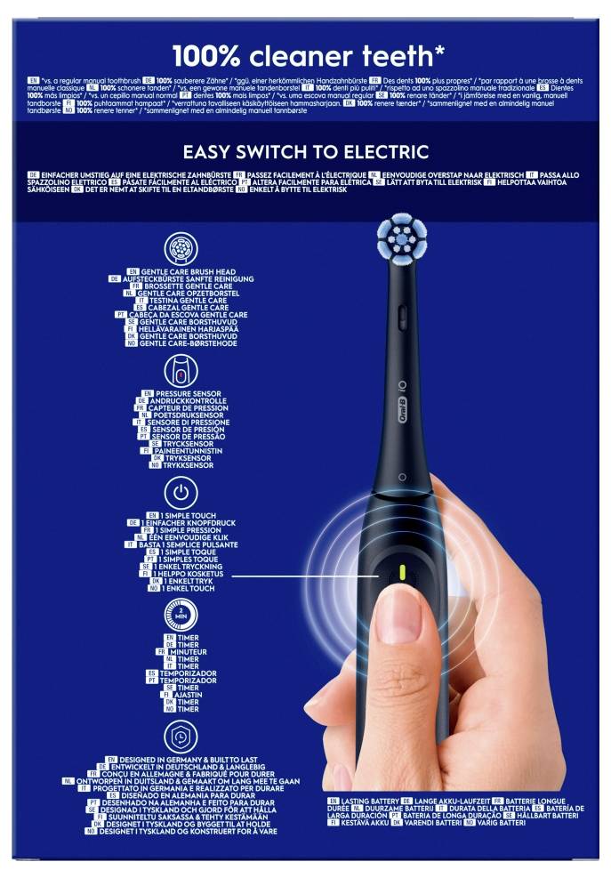 Roka drži črno električno zobno ščetko na embalaži z besedilom: '100% čistejši zobje'. Navedene so funkcije in prednosti zobne ščetke.