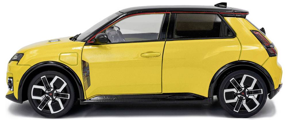 Rumena hatchback avtomobilska različica s črnimi okrasnimi elementi in edinstveno obliko koles, prikazana s stranske perspektive, ki poudarja njen kompakten in športen videz.
