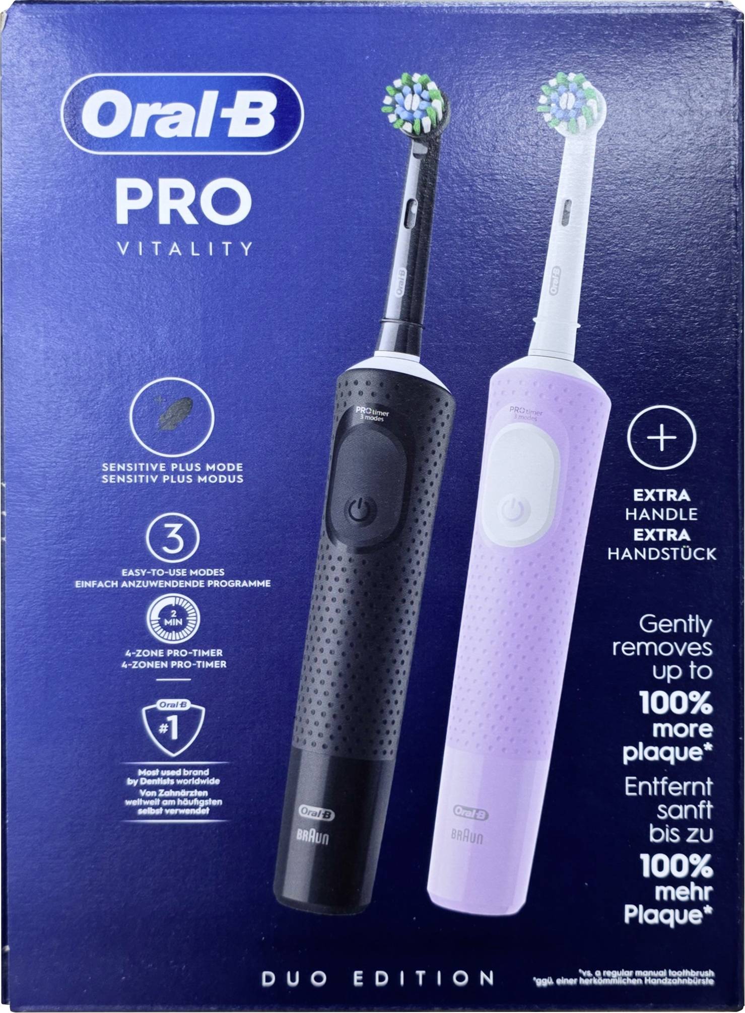 Škatla 'Oral-B PRO VITALITY DUO EDITION', ki prikazuje dva električna zobni ščetki, črne in rožnate barve, označena z načinom za občutljive zobe in odstranjevanjem zobnih oblog.