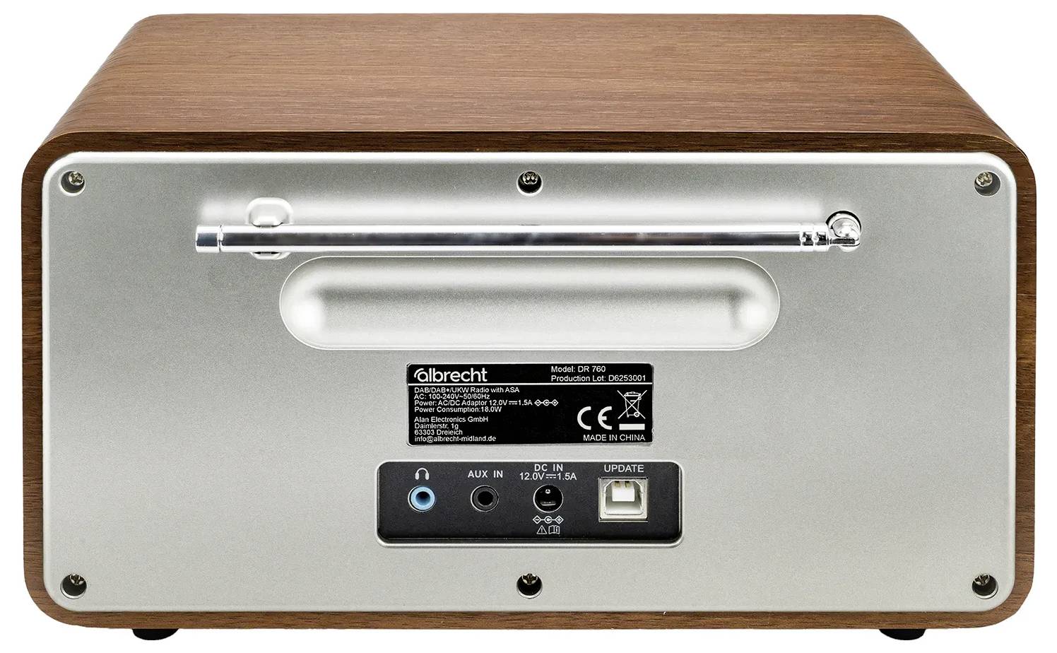 Slika prikazuje hrbet retro-sloganskega radia z lesenim prebleskom, ki ima avdio vhodne priključke, vhod za napajanje in kontrolno oznako.