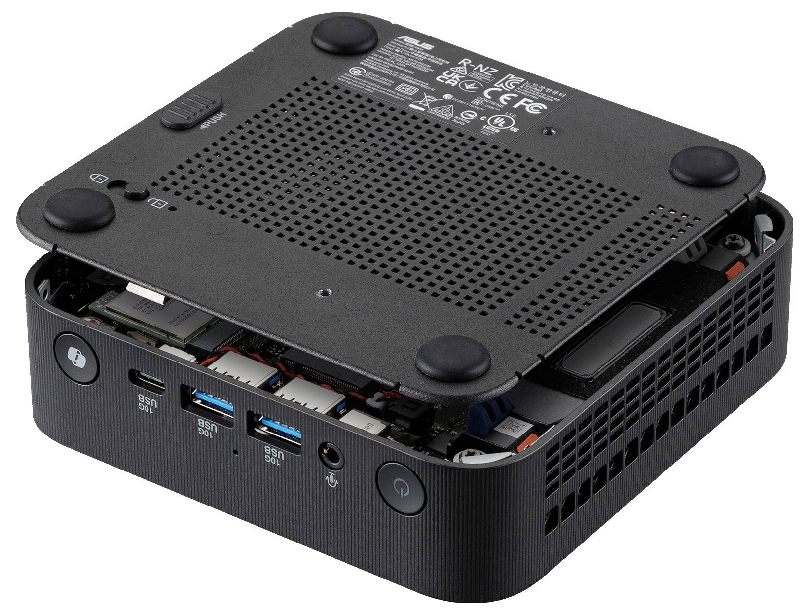 Kompakten mini PC z dvignjeno zgornjo pokrovko, ki razkriva notranje komponente in sprednjih vhodov, vključno z USB in gumbom za vključitev.