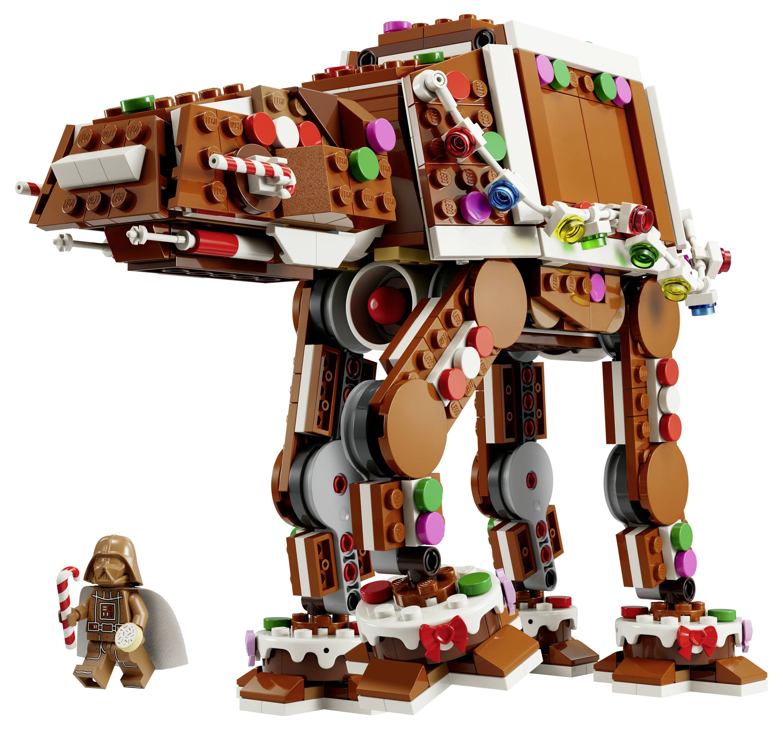 LEGO-podobni velikanskega čokoladnorjavega AT-AT sprehajalnika s pisanimi bonbonskimi detajli in majhno figurico Dartha Vadera, ki stoji poleg njega.