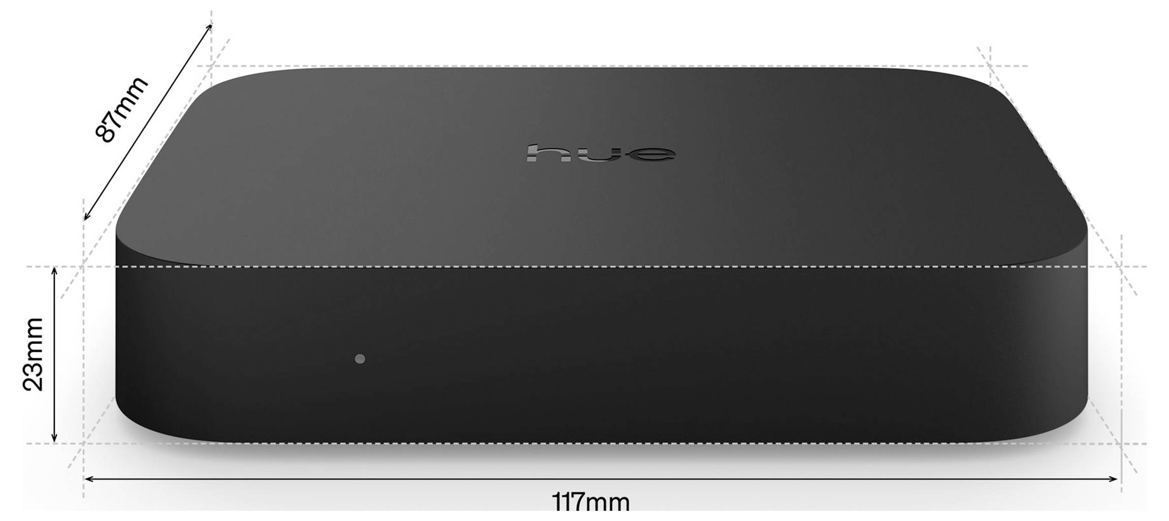 Diagram z dimenzijami malega zaobljenega pravokotnega črnega naprave, označen s širino 117 mm, globino 87 mm in višino 23 mm.