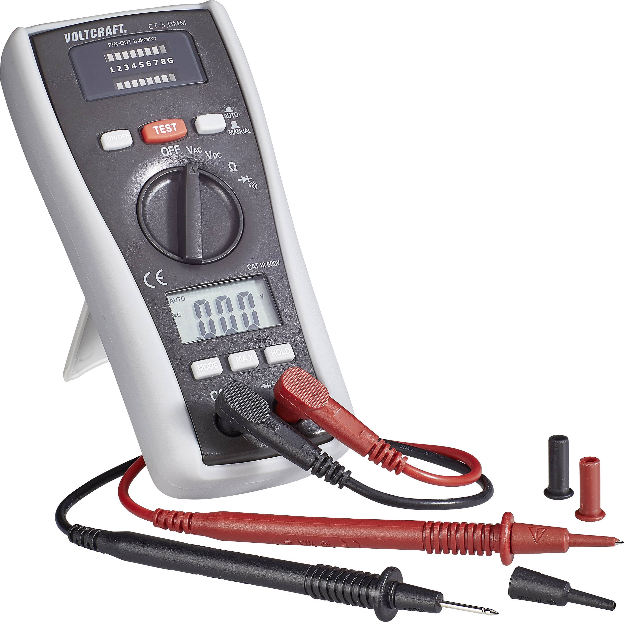Digitalni multimeter na zaslonu prikazuje 'AUTO' in '10.00'. Ima rdeče in črne merilne kable ter je v merilnem načinu.