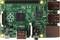 Raspberry Pi Model B plošča z več priključki in komponentami. Zgornja stran prikazuje procesor, USB- in HDMI-priključke.