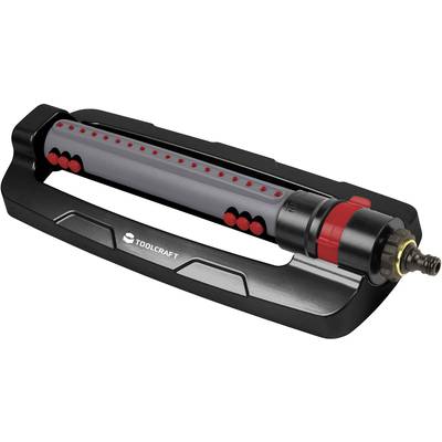 Črn, pravokoten škropilnik za travo z rdečimi in sivimi poudarki, blagovne znamke 'TOOLCRAFT'.