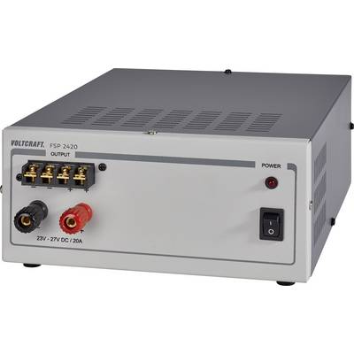 Siva napajalna enota z napisom 'Voltcraft FSP 2420'. Prikazuje vhode in izhode s stikalno letvijo in indikatorjem moči.