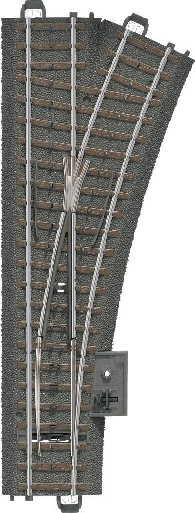 En modelljärnvägsskena med växel som möjliggör en avgrening åt höger. Rälsen är monterad på en brun ballastsäng.