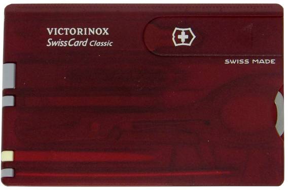 Röd SwissCard Classic från Victorinox med logotyp och text, innehåller olika verktyg som sax och nagelfil, kompakt förpackad.