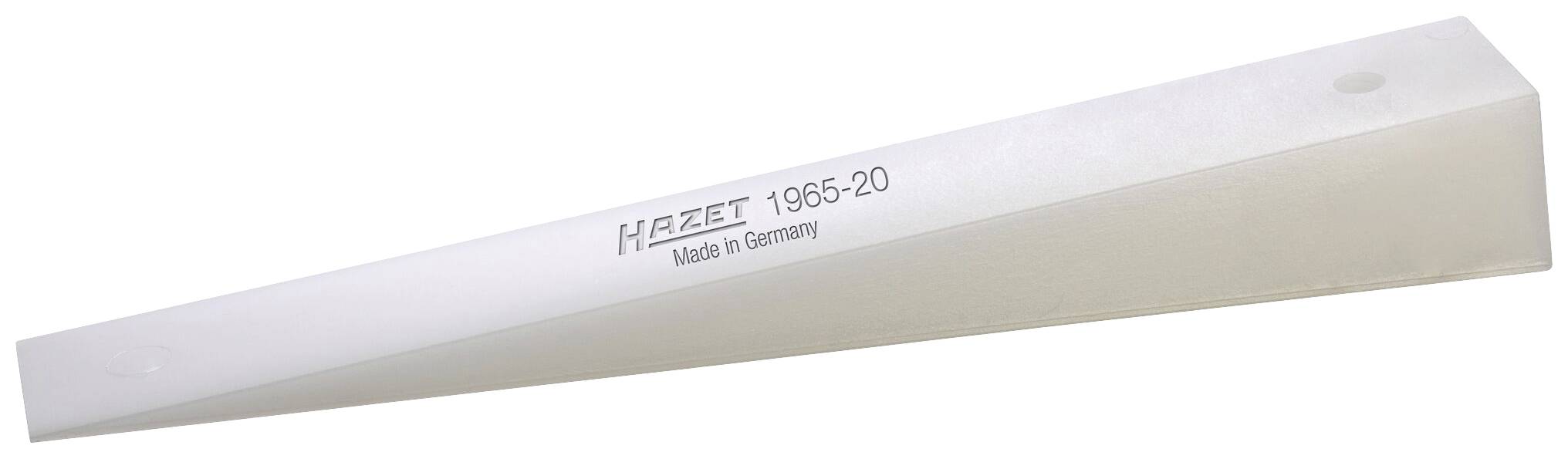 Ett kilformat verktyg av plast med påskriften 'HAZET 1965-20 Made in Germany', sannolikt avsett för montering eller demontering.