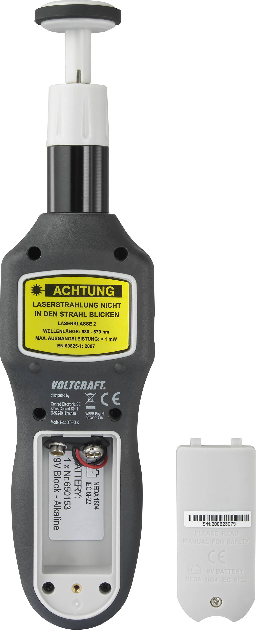 Ett mätinstrument med en gul varningstext: 'Varning laserstrålning - titta inte in i strålen'. Bredvid finns ett batterifackslock.