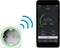 Smart-uttag bredvid smartphone med app-skärm. Appen visar energiförbrukningen: 161,90 watt. Ansluten via WiFi.