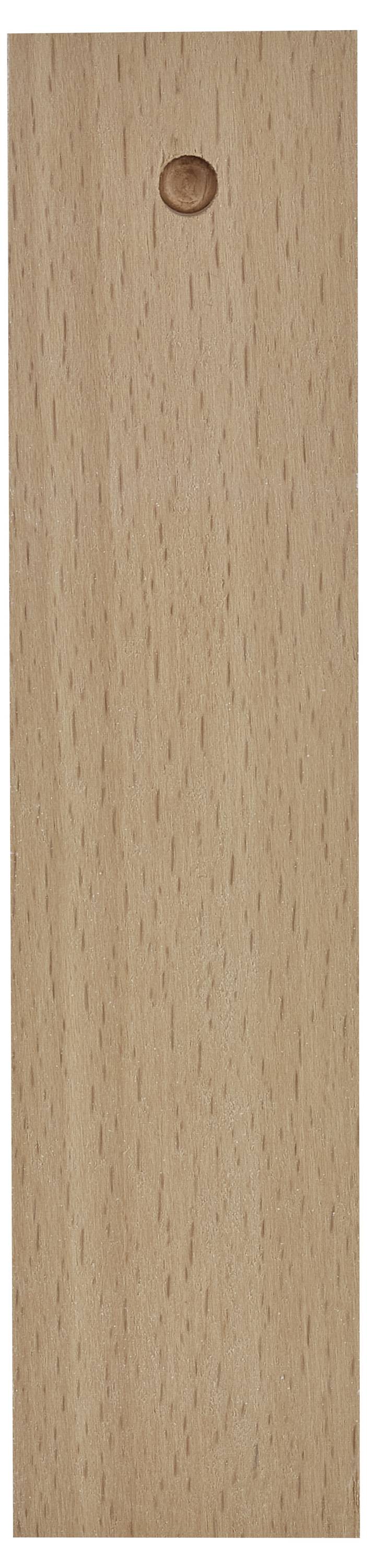 Närbild av en ljus träpanel med ett litet cirkulärt hål nära den övre mitten.