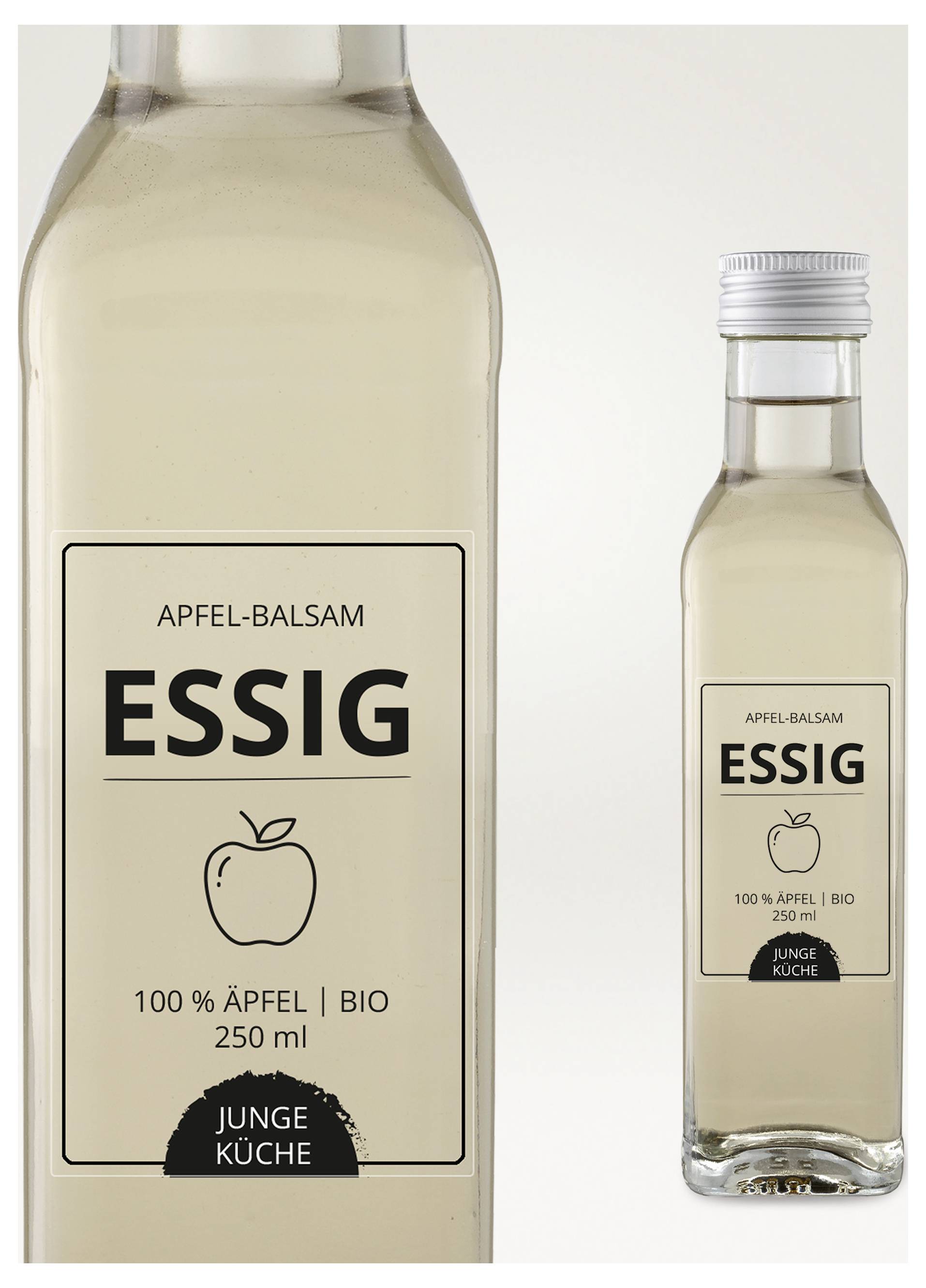 Två flaskor äppel-balsamvinäger från "Ung Kök", stor och liten, med etikett "ÄPPEL-BALSAMVINÄGER", äpple-ikon och "100 % ÄPPLEN | BIO 250 ml".