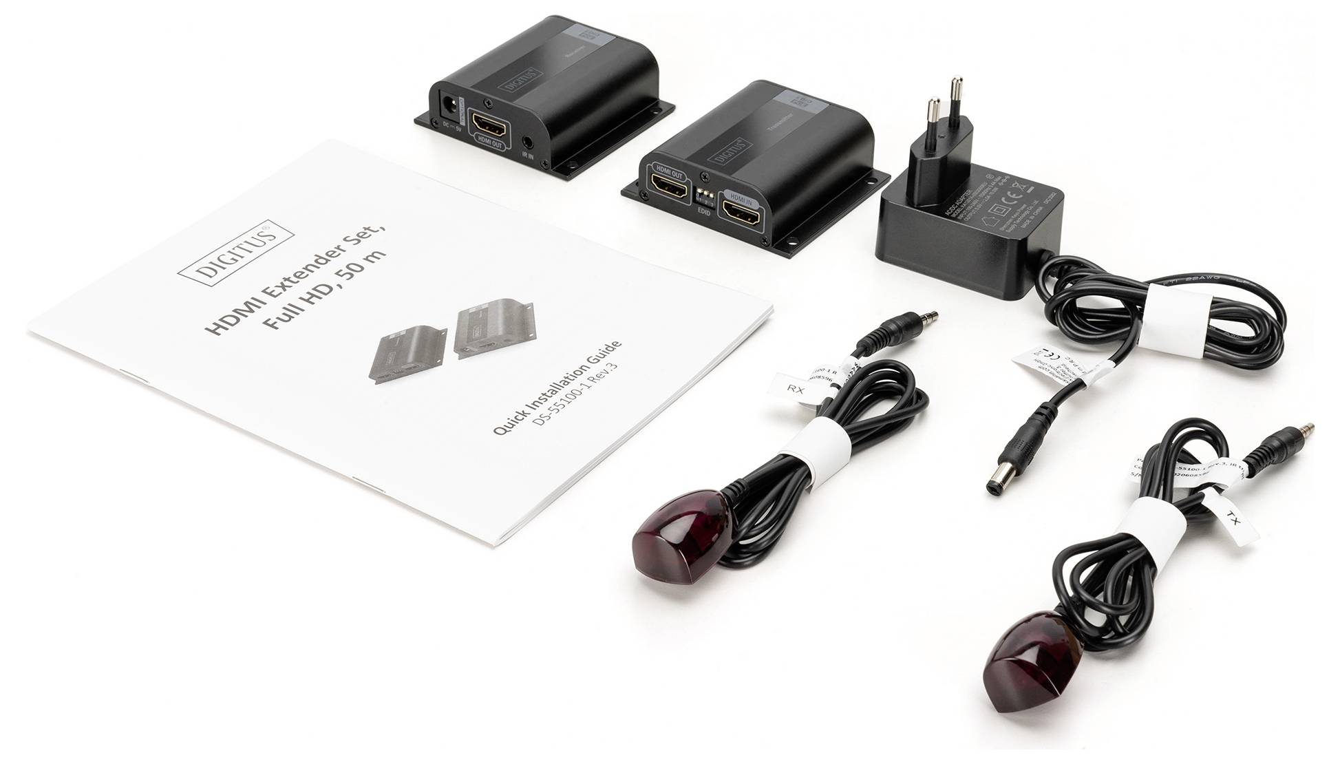 HDMI-förlängningsset med två svarta moduler, nätadapter, två IR-sensorer, bruksanvisning och kablar.