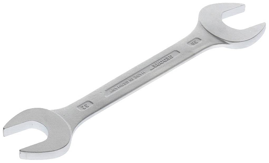 En silverfärgad skiftnyckelnyckel med storlek 32 mm och 36 mm visas snett uppifrån.