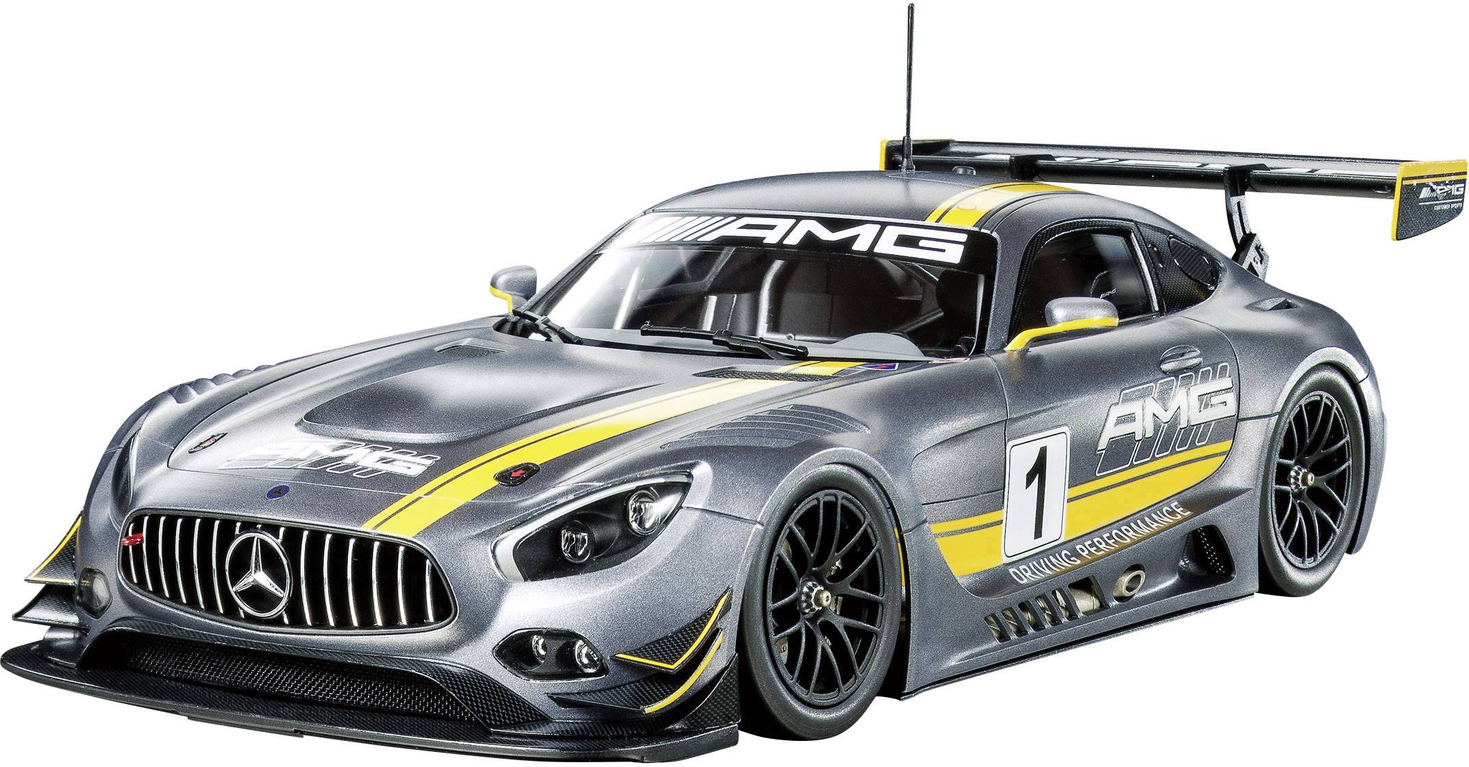 Silverfärgad sportbilsmodell med gula accenter och AMG-logotyp på motorhuven. Nummer 1 på sidan.
