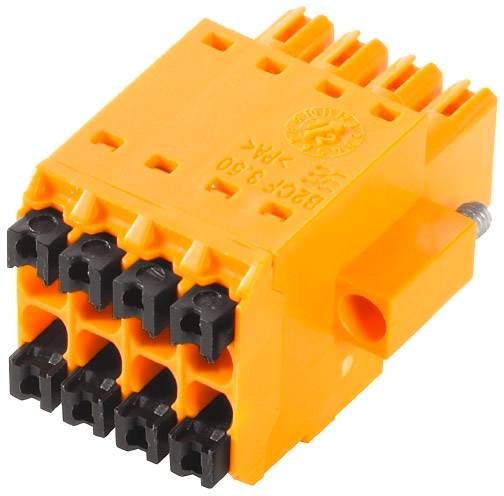 Orange kopplingsdon med flera svarta anslutningar. Tydligt identifierbar som en elektrisk komponent.