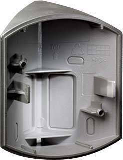 Grå, tom väggfäste av plast med uttag för ledningar och fästhål, sannolikt avsedd för sanitets- eller elinstallation.